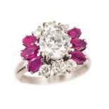 A highcarat diamond ruby ring 18 ct. white gold, marked. The center diam. in round cut of very