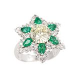 A highcarat diamond emerald ring 18 ct. white gold, marked. In the center one round cut diam.