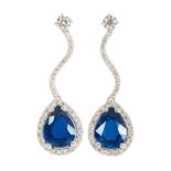 A pair of fine sapphire diamond earpendants 18 ct. white gold. Each with one sapphire in pear shaped