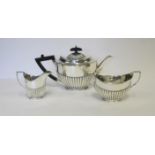 AN ASSEMBLED THREE-PIECE SILVER TEA SET, VARIOUS MAKERS, LONDON, 1901 AND 1907 comprising: a teapot,