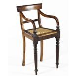 A CAPE STINKWOOD HIGHCHAIR, LATE 19TH CENTURY the curved top and mid-rail between curved arms on