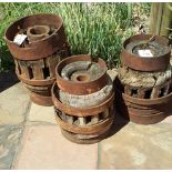 THREE OX WAGON WHEEL HUBS, 19TH CENTURY distress the tallest 36cm high; and A Wooden Utensil 4