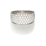 A DIAMOND RING designed as a tapered band pavé set to the centre with brilliant-cut diamonds