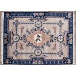 A CHINESE CARPET,MODERN the pale beige field with a blue and gold fret medallion with a horse,