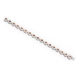 A DIAMOND BRACELET designed as a series of square links each claw set to the centre with a fancy-