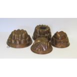 A MISCELLANEOUS COLLECTION OF FOUR COPPER JELLY MOULDS various shapes and sizes, the largest 11,
