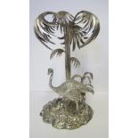 AN ELECTROPLATE CENTREPIECE the rock base with an ostrich beneath a palm tree, 39cm high 1
