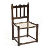 A STINKWOOD TRANSITIONAL TULBAGH CHAIR the shaped and reeded top and plain reeded bottom rail joined