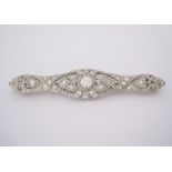 AN EDWARDIAN-STYLE DIAMOND BAR BROOCH the open-worked plaque centred with a round brilliant-cut