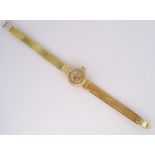 A LADY'S 18CT GOLD WRISTWATCH, OMEGA LADYMATIC automatic, the circular gilt dial with gilt baton