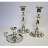 A PAIR OF ELECTROPLATE CANDLESTICKS each reeded oval base with a gadrooned band, the knopped stem