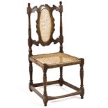 A CAPE STINKWOOD TULBAGH CHAIR the carved and scrolling top rail between turned supports