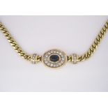 A SAPPHIRE AND DIAMOND NECKLACE centred with an oval cabochon sapphire weighing approximately 2.
