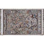 AN INDO PERSIAN PART SILK RUG,MODERN the ivory field with a one directional design of polychrome