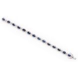 A SAPPHIRE AND DIAMOND BRACELET designed as a series of oval links, each centred with an oval