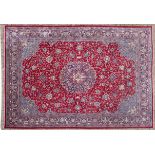 A SAROUK CARPET, PERSIA, MODERN the red field with a floral blue and ivory star medallion, sky