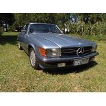 A 1985 Mercedes 500SL Roadster with both soft and hardtop, good patina. 4973cc, V-8 engine,