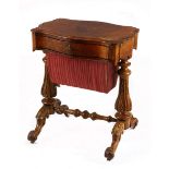 A Victorian burr walnut sewing table the rectangular serpentine-shaped top above a conforming frieze
