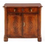 A small Victorian flame mahogany side cabinet the shaped rectangular top above a frieze drawer,