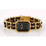 A LADY'S GOLD PLATED WRISTWATCH, CHANEL PREMIERE quartz, the rectangular black dial applied with