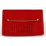 A Lorenzi red Crocodile handbag.  Authentic Lorenzi handbag. Gold tone hardware. Magnetic closure.