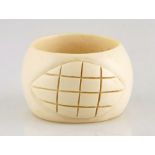 A large carved ivory bangle carved with two leaf-shaped motifs of lattice design Not suitable for