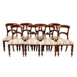 A harlequin set of Victorian mahogany dining chairs, 19th century each with an arched top rail