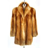 A Woman's red fox coat.  NOT SUITABLE FOR EXPORT Full length. 85cm in length from the nape of the