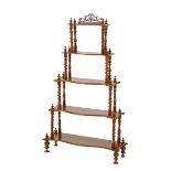 A Victorian walnut five-tiered whatnot, late 19th century each shaped rectangular tier raised on