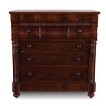 A large Victorian flame mahogany chest of drawers, 19th century the rectangular outset top above