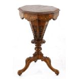 A Victorian oak, walnut and inlaid sewing table, 19th century the octagonal hinged top enclosing a