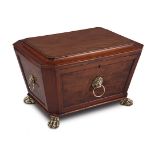 A George III mahogany and brass mounted cellaret, early 19th century sarcophagus-shaped, the