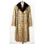 A Vintage Woman's Cheetah fur with brown Mink collar.  NOT SUITABLE FOR EXPORT Full length coat.