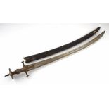 AN INDIAN TULWAR, 18TH CENTURY all steel hilt of characteristic form with D-guard, curved broad