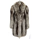 A Woman's silver fox coat.  NOT SUITABLE FOR EXPORT Full length coat. 85cm in length from the nape