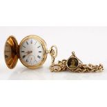 A 14CT GOLD HUNTER-CASED POCKET WATCH, the white dial with black Roman numerals and calibrated outer