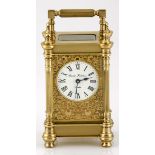 A BRASS CARRIAGE CLOCK, CHARLES FRODSHAM, LONDON the 5cm white dial with black Roman numerals signed