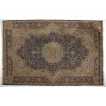 A Kirman Carpet, East Persia, Modern the indigo blue field with a pale blue and gold floral
