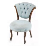 A Victorian walnut and upholstered occasional chair, late 19th century the shaped button-back