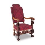 A carved walnut and upholstered armchair, late 19th century the shaped rectangular padded back above