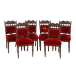 A set of six Victorian mahogany dining chairs, late 19th century each with a leaf-carved arched