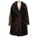 A Vintage Woman's chocolate brown Seal fur coat.  NOT SUITABLE FOR EXPORT Label: "James Fong Fur