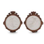 A pair of Royal Copenhagen bisque plaques of 'Night' and 'Day', 1891-1896 after the marble originals