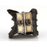 A crocodile skin cuff, 20th century with a rectangular bone-inlaid clasp centred with two cabochon