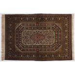 A Qum Rug, Persia, Modern the field with four concentric floral medallion depicted in red, blue,