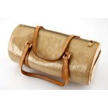 A Louis Vuitton Bedford Noisette handbag.  Embossed golden monogram patent leather. Natural