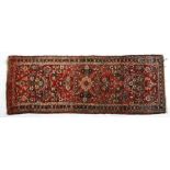 A Birjalough Runner, Persian, Modern the red field with a floral medallion and flowering shrubs
