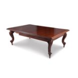An impressive Victorian mahogany extending dining table the moulded rectangular top raised on