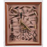 A collection of antique corkscrews comprising various shapes and sizes, in ivory, bone, wood and