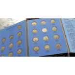 Great Britain Shillings Collections, 1920/62. In 3 small blue albums, also USA ½ dollars and other